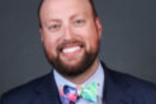 A man wearing a bow tie and a suit.